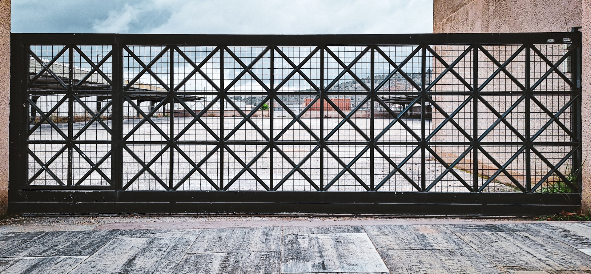 A metal gate with a diamond pattern.